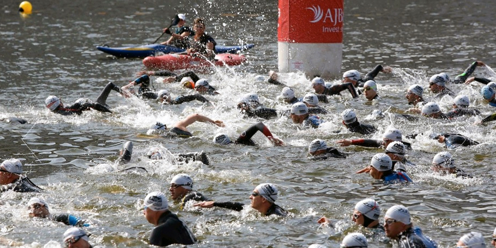Swimmers in the River Thames competing in the London Triathlon